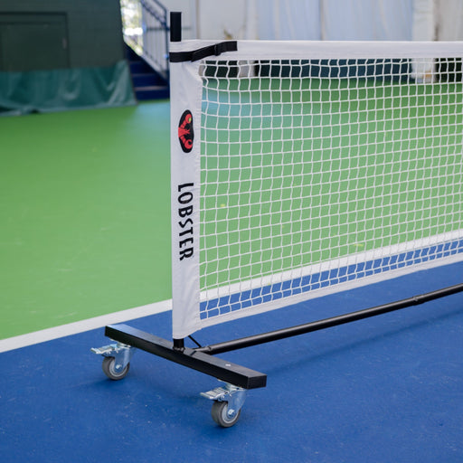 Lobster portable pickleball net on an indoor court
