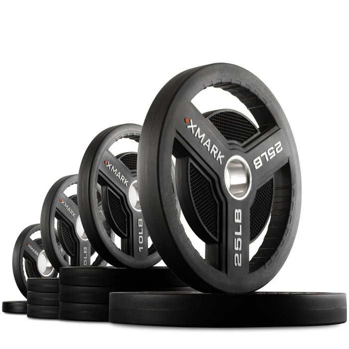 XMARK Commercial Urethane Olympic Weight Plates — full setup angle