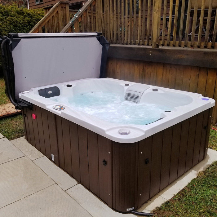Liberty Spas LYS4000 4-person plug and play hot tub installed on a backyard patio