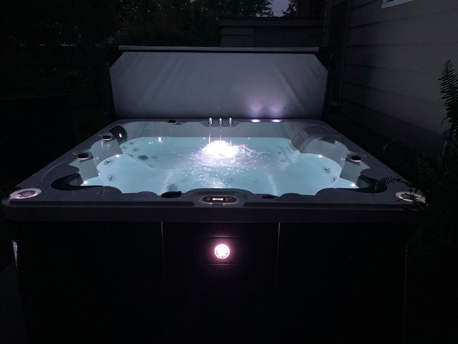 Liberty Spas LYS6000 6-person 240V hot tub lit at night