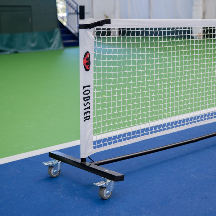 Lobster portable pickleball net on an indoor court